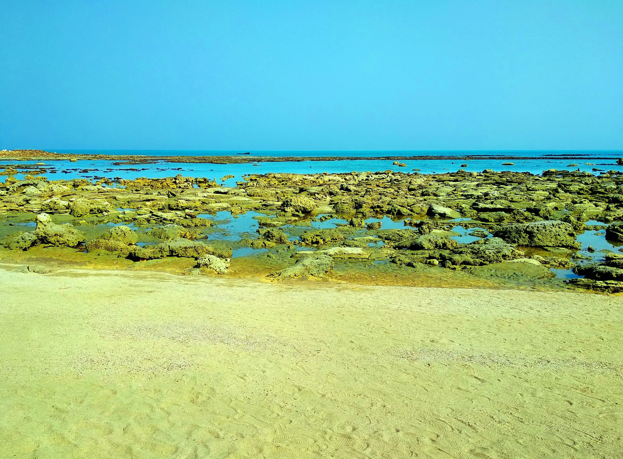 Coral beach and clear sea at Chera Dwip
